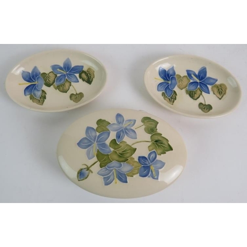 54 - A Moorcroft hibiscus pattern baluster vase 13.5cm, two similar blue hibiscus pattern pin dishes and ... 