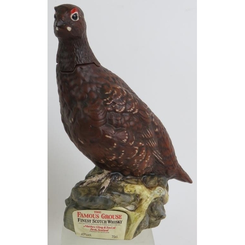 56 - A Royal Doulton Famous Grouse Scotch Whisky decanter, (empty) four Beneagles Scotch Whisky figural b... 