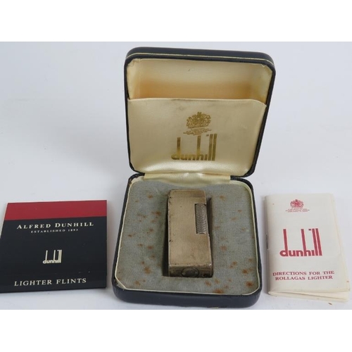 58 - A vintage hallmarked silver Dunhill Rollagas cigarette lighter in case with instructions plus anothe... 