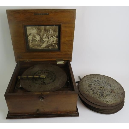 6 - A Polyphone table top music box in an inlaid walnut case with a large quantity of 28cm discs - label... 