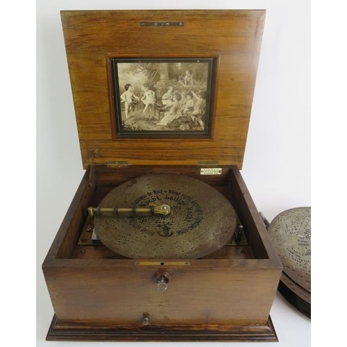 6 - A Polyphone table top music box in an inlaid walnut case with a large quantity of 28cm discs - label... 