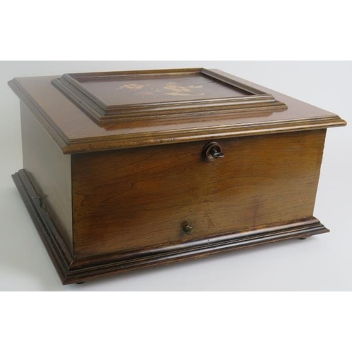 6 - A Polyphone table top music box in an inlaid walnut case with a large quantity of 28cm discs - label... 