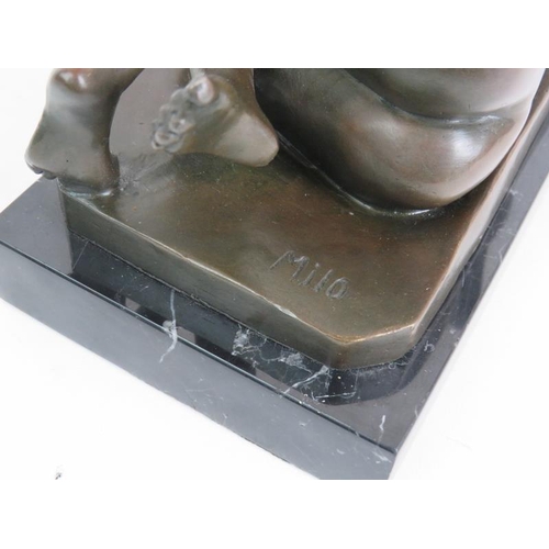 61 - A Contemporary bronze figure of a recumbent nude signed Milo and mounted on a black marble base. Len... 