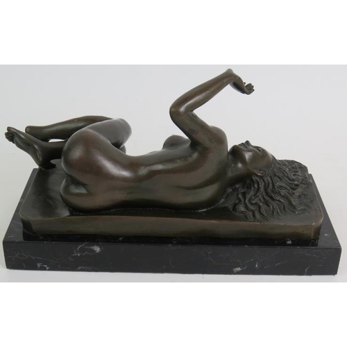 61 - A Contemporary bronze figure of a recumbent nude signed Milo and mounted on a black marble base. Len... 