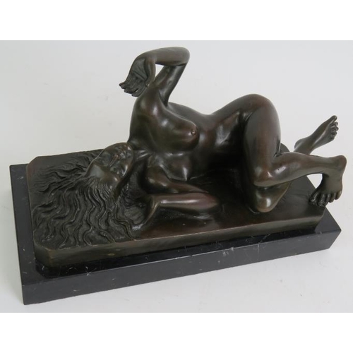 61 - A Contemporary bronze figure of a recumbent nude signed Milo and mounted on a black marble base. Len... 