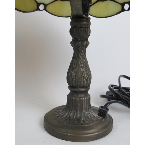 69 - A pair of Contemporary Tiffany style bedside lamps on bronze foliate bases and with pearl stained gl... 