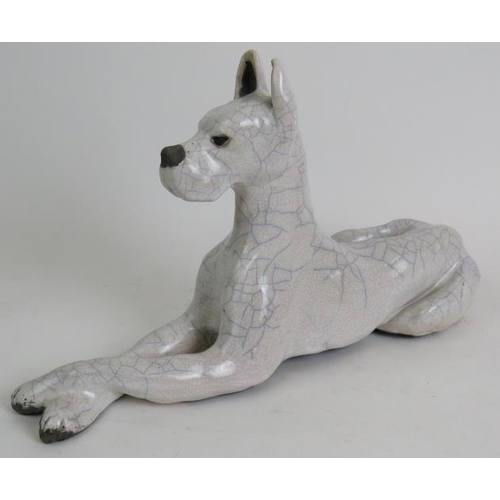 82 - A crackle glazed Raku pottery Great Dane dog in recumbent pose, signed and dated to base. Length 37c... 