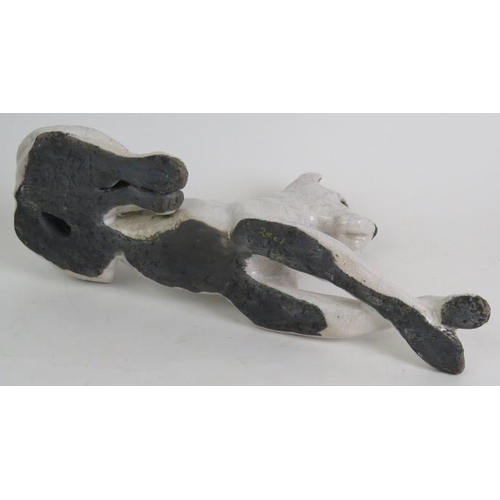 82 - A crackle glazed Raku pottery Great Dane dog in recumbent pose, signed and dated to base. Length 37c... 