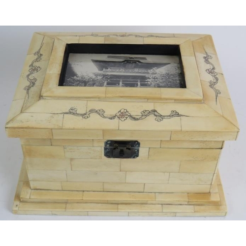 83 - A contemporary decorative bone clad trinket or jewellery box with picture inset to lid. Width 27cm. ... 