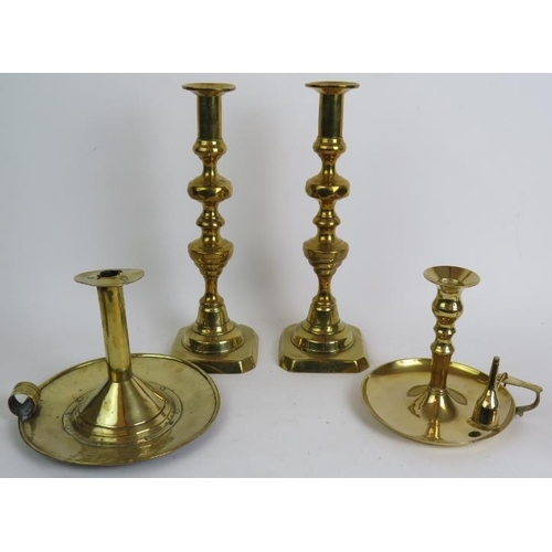 87 - A pair of antique brass aesthetic movement candlesticks, a pair of tall Georgian style candlesticks,... 