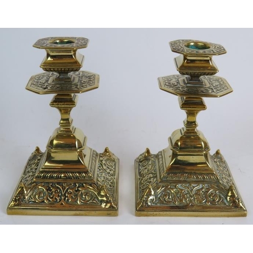 87 - A pair of antique brass aesthetic movement candlesticks, a pair of tall Georgian style candlesticks,... 