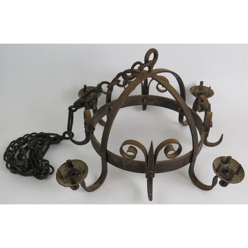 88 - A Medieval style wrought iron four sconce chandelier with heavy handing chain. Max diameter 52cm.
Co... 