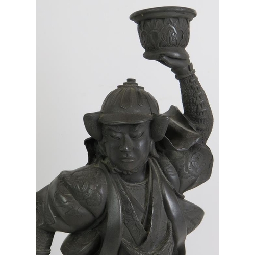 91 - A well cast metal figure of a Japanese Samurai warrior on marble style plinth. Overall height 42cm.
... 