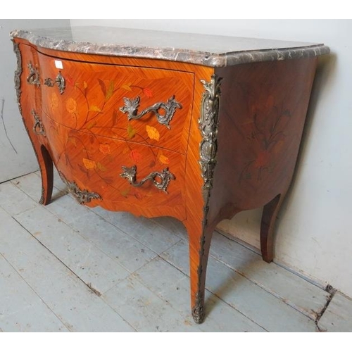 703 - A reproduction 19th century style French tulipwood commode chest featuring black serpentine marble t... 