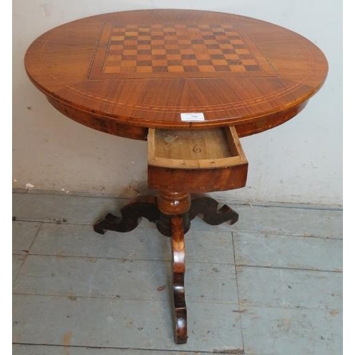 704 - A 19th century walnut parquetry inlaid circular games table, with chessboard inlay & single blind fr... 