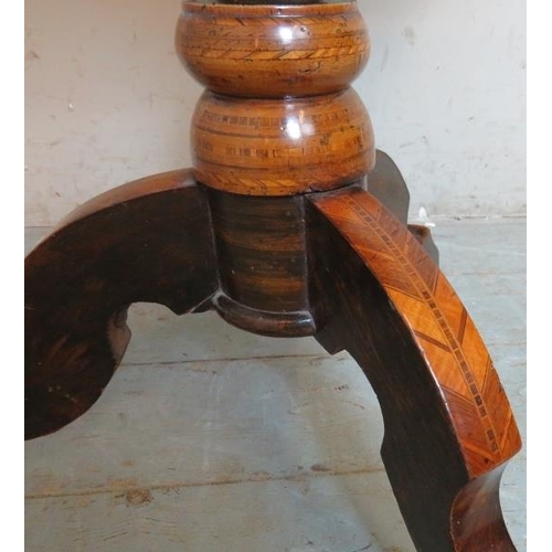 704 - A 19th century walnut parquetry inlaid circular games table, with chessboard inlay & single blind fr... 