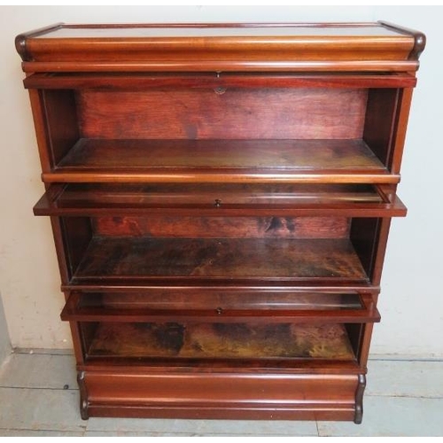 705 - A vintage mahogany three section glazed Globe Wenicke bookcase, raised on a plinth base.
Condition r... 