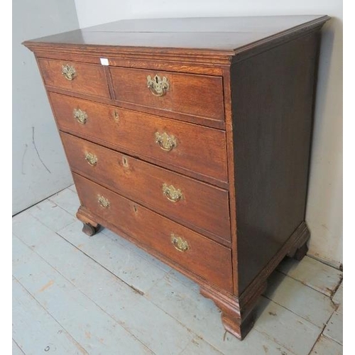 706 - A George III oak chest of drawers of excellent colour, comprising two short over three long graduate... 