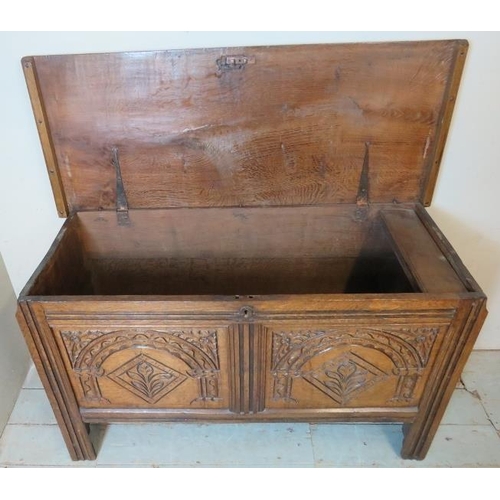 708 - An 18th century medium oak coffer of excellent colour with internal candlebox & carved decoration to... 