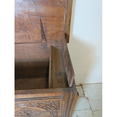 708 - An 18th century medium oak coffer of excellent colour with internal candlebox & carved decoration to... 