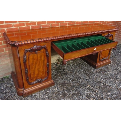 710 - A very large good quality Victorian figured mahogany sideboard featuring gadrooned edging & applied ... 