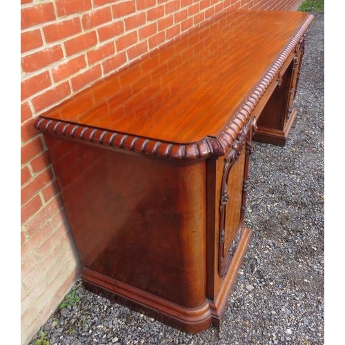 710 - A very large good quality Victorian figured mahogany sideboard featuring gadrooned edging & applied ... 