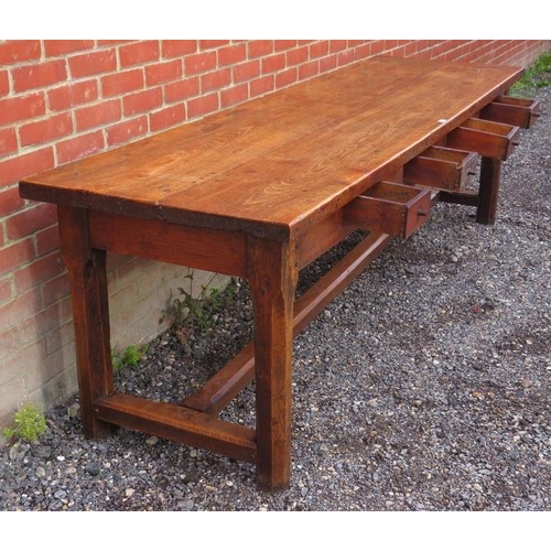 711 - A very large 18th/19th century country made fruitwood kitching/dining table with four frieze drawers... 