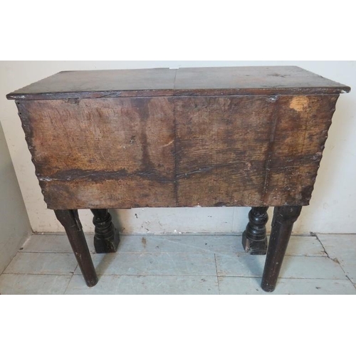 716 - An antique oak sideboard, composed of ornately carved 17th century elements, with two cupboard doors... 