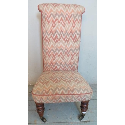 721 - A 19th century prie-dieu chair upholstered in contemporary multicoloured fabric, raised on turned ta... 