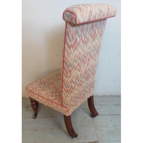 721 - A 19th century prie-dieu chair upholstered in contemporary multicoloured fabric, raised on turned ta... 