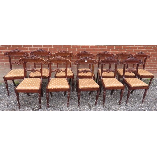 722 - A set of twelve WilliamIV/early Victorian mahogany dining chairs with ornately carved backrests depi... 