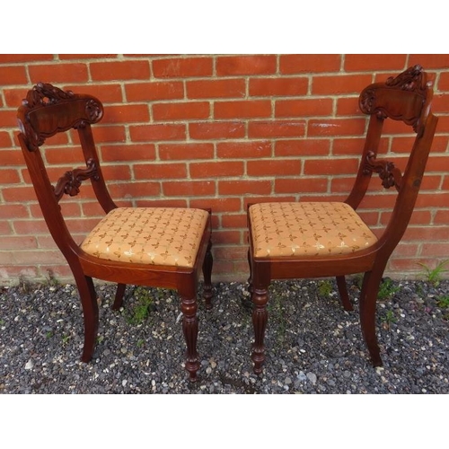 722 - A set of twelve WilliamIV/early Victorian mahogany dining chairs with ornately carved backrests depi... 