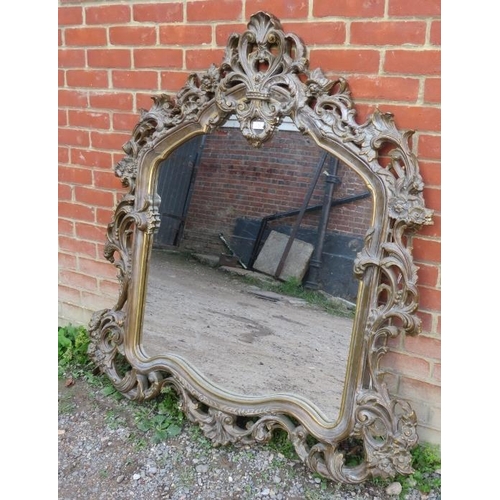 728 - A very ornate large mirror to match previous (lot 727). The carved & pierced giltwood surround adorn... 