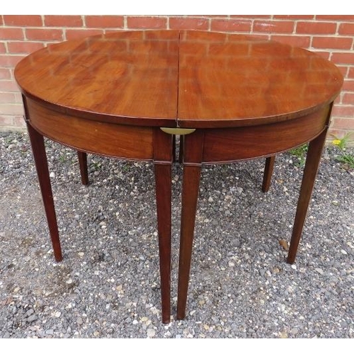 736 - A Georgian mahogany drop leaf dining table with two removable 'D end' sections, raised on tapering s... 