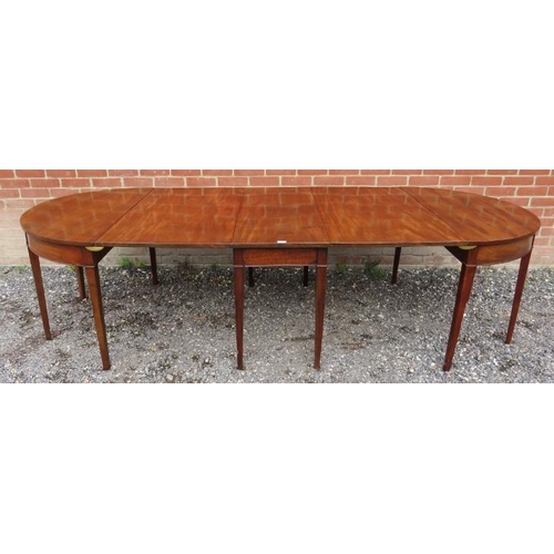 736 - A Georgian mahogany drop leaf dining table with two removable 'D end' sections, raised on tapering s... 