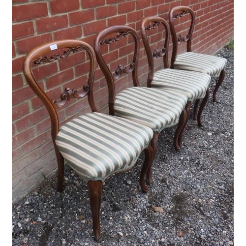 740 - A set of four Victorian fruitwood balloon back dining chairs with carved & pierced backrests, raised... 