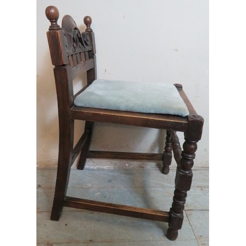 748 - A turn of the century oak music seat in the Jacobean revival taste, with scrolled & pierced backrest... 