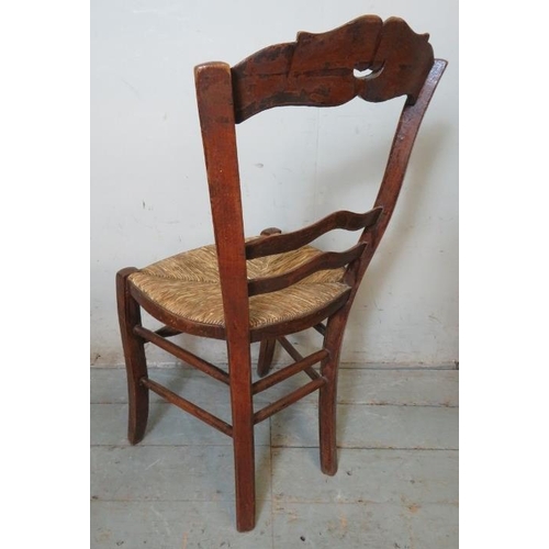 750 - A set of four 19th century French fruitwood country made farmhouse kitchen chairs with shaped & pier... 