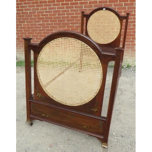 755 - An Edwardian mahogany single bed with bergere panels to headboard & footboard, hand painted with flo... 