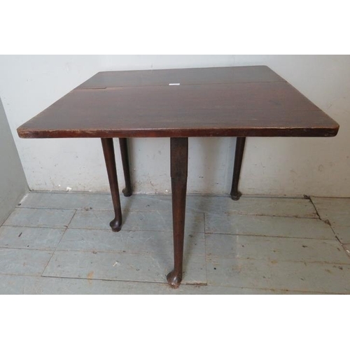 759 - A Georgian mahogany single drop leaf table with gateleg action, raised on tapering supports with pad... 