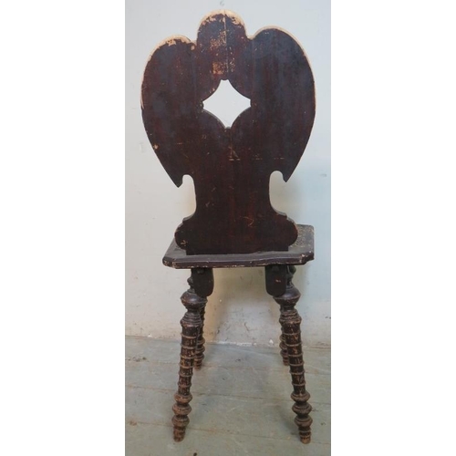 762 - A turn of the century aesthetic period oak hall chair, the shaped & pierced back rests and seat heav... 