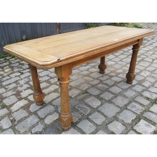 763 - A vintage solid French light oak kitchen table raised on tapering baluster supports with bun feet.
C... 