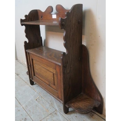 775 - An Arts & Crafts wall hanging shelf with single cabinet.
Condition report: Minor marks consistent wi... 