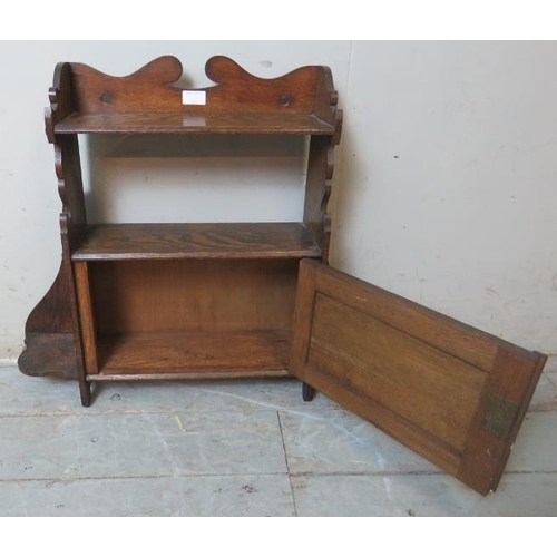 775 - An Arts & Crafts wall hanging shelf with single cabinet.
Condition report: Minor marks consistent wi... 