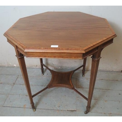 778 - An Edwardian Regency revival mahogany octagonal centre table inlaid & crossbanded and strung with bo... 