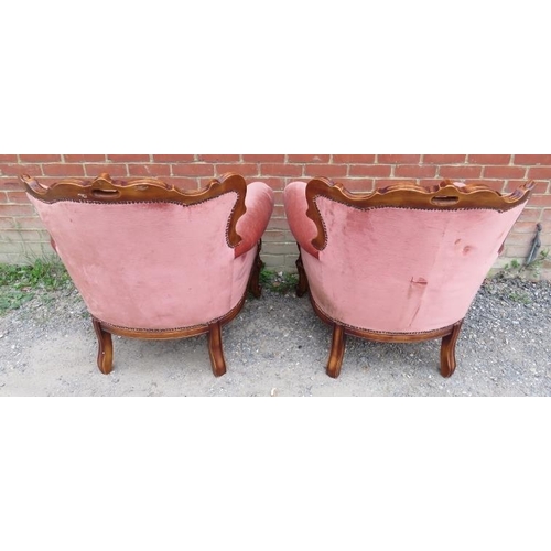 792 - A pair of reproduction French show-wood armchairs in the 19th century taste, upholstered in salmon b... 