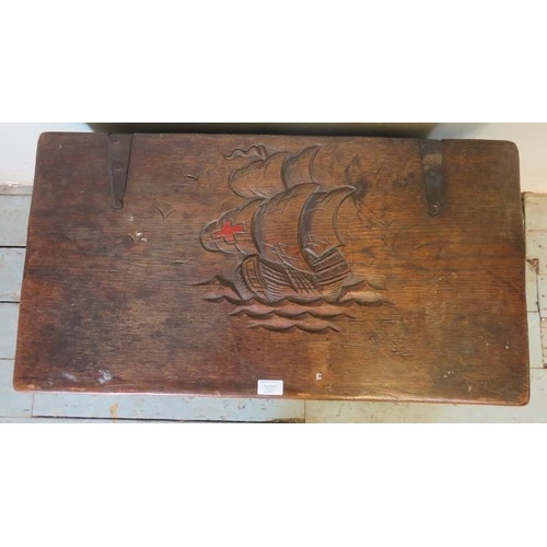 796 - A small antique oak metal bound coffer/blanket box with relief carving to lid depicting a ship at se... 