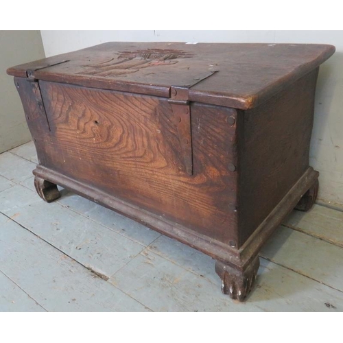 796 - A small antique oak metal bound coffer/blanket box with relief carving to lid depicting a ship at se... 