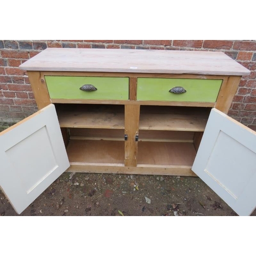 809 - A stripped antique pine sideboard containing two short drawers with fancy scallop handles over two c... 