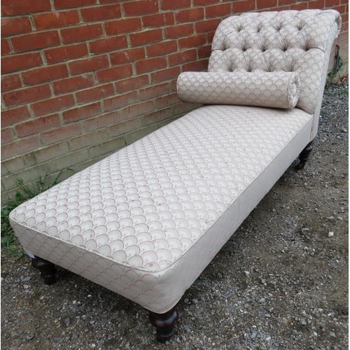 834 - A Victorian chaise longue with buttoned & scrolled backrest, raised on turned tapering supports with... 